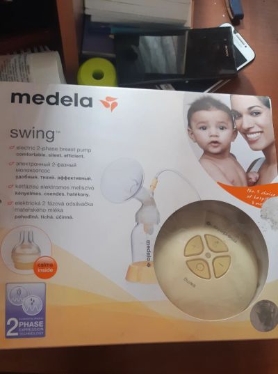 Лот: 19020755. Фото: 1. Молокоотсос Medela Swing + Соска... Всё для кормления