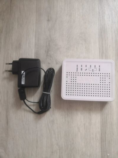 Лот: 25734029. Фото: 1. Абонентский VOIP-шлюз ELTEX TAU-1M... Маршрутизаторы (роутеры)