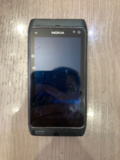 Лот: 18684708. Фото: 1. Смартфон Nokia N8 плохо заряжается. Смартфоны