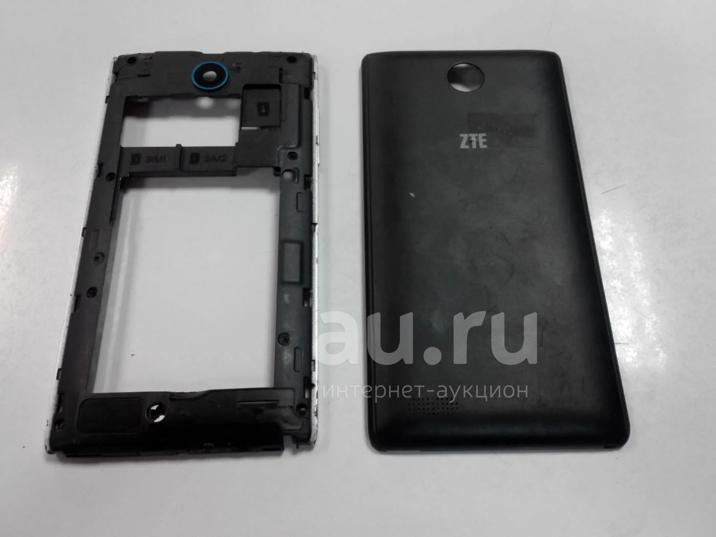 Задняя крышка и задняя часть корпуса ZTE V815W — купить в Красноярске.  Состояние: Б/у. Корпуса, клавиатуры, кнопки на интернет-аукционе Au.ru